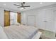 Spacious main bedroom featuring a ceiling fan, sliding barn doors into the bath and double closets at 115 Ridge Rd, Summerville, SC 29485
