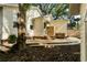 Tranquil backyard with mature tree, deck, and convenient outdoor shower at 116 Magnolia Ave, Charleston, SC 29403