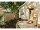 Outdoor living space with wooden deck, privacy fence, and mature landscaping at 116 Magnolia Ave, Charleston, SC 29403