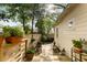 Cozy Backyard patio featuring a wooden fence, plants, and furniture at 116 Magnolia Ave, Charleston, SC 29403
