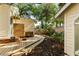 Backyard with wooden deck, outdoor shower, and professional landscaping at 116 Magnolia Ave, Charleston, SC 29403