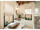 Sunlit bathroom with custom cabinets, undermount sink, and open view to the garden at 116 Magnolia Ave, Charleston, SC 29403