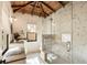 Bathroom features a glass shower, stylish vanity, and vaulted wood ceiling at 116 Magnolia Ave, Charleston, SC 29403