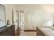 View of the bedroom featuring hardwood floors, a large area rug and multiple doorways at 116 Magnolia Ave, Charleston, SC 29403