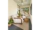 Cozy front porch featuring comfortable seating, area rug, and windows that provide lots of natural light at 116 Magnolia Ave, Charleston, SC 29403