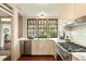 Kitchen featuring stainless appliances, marble countertops, and a view of the outside at 116 Magnolia Ave, Charleston, SC 29403