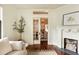 Bright living room featuring a fireplace, hardwood floors, and neutral tones, creating a cozy and inviting atmosphere at 116 Magnolia Ave, Charleston, SC 29403