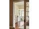 View through doorway of a bright and airy living room with hardwood floors and access to the outdoors at 116 Magnolia Ave, Charleston, SC 29403