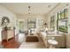Inviting living room with large windows, hardwood floors, and stylish furnishings, offering a comfortable living space at 116 Magnolia Ave, Charleston, SC 29403