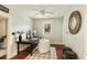 Cozy office featuring hard wood floors, a ceiling fan, and views to the outside at 116 Magnolia Ave, Charleston, SC 29403