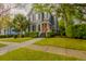 Charming two-story home with a vibrant orange front door and well-manicured lawn at 117 Lucia St, Charleston, SC 29492