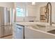 Modern kitchen featuring stainless steel appliances, farmhouse sink, and white cabinets at 117 Lucia St, Charleston, SC 29492