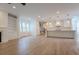 Spacious living room features hardwood floors, fireplace and open floor plan with kitchen at 117 Lucia St, Charleston, SC 29492