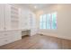 Bright home office with custom built-in shelving, desk and a large window at 117 Lucia St, Charleston, SC 29492