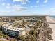 Inviting aerial view of condos with landscaped grounds and beachfront access at 1300 Ocean Blvd # 308, Isle of Palms, SC 29451
