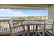 Relaxing balcony with seating offers stunning ocean views and a refreshing coastal breeze at 1300 Ocean Blvd # 308, Isle of Palms, SC 29451