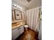 Cozy bathroom features a neutral color palette, vanity, and shower with curtain at 1300 Ocean Blvd # 308, Isle of Palms, SC 29451
