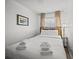Serene bedroom with a comfortable bed, warm lighting, and a tranquil ambiance for a peaceful night's rest at 1300 Ocean Blvd # 308, Isle of Palms, SC 29451