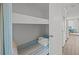 Cozy bunk room with a blue and white striped mattress and fresh towels for a comfortable stay at 1300 Ocean Blvd # 308, Isle of Palms, SC 29451