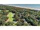 An aerial view of the property showing its proximity to a golf course, lush vegetation, and the beach at 1365 Dunlin Court, Share D, Kiawah Island, SC 29455