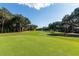 Expansive golf course view with lush green grass and mature trees on a sunny day, perfect for golfers at 1365 Dunlin Court, Share D, Kiawah Island, SC 29455
