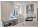 Bright, modern kitchen with stainless steel appliances, marble counters, and ample storage at 1365 Dunlin Court, Share D, Kiawah Island, SC 29455