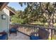Cozy porch featuring comfortable seating and serene views of the golf course and trees at 1365 Dunlin Court, Share D, Kiawah Island, SC 29455
