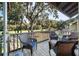 Relaxing porch with comfortable wicker seating and serene golf course views at 1365 Dunlin Court, Share D, Kiawah Island, SC 29455