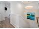 Bright stairway with modern lighting and artwork, leading to the upper level at 1365 Dunlin Court, Share D, Kiawah Island, SC 29455