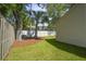 Lush backyard featuring a manicured lawn, shade trees and privacy fencing at 1366 W Point Dr, Mount Pleasant, SC 29466