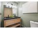 Stylish bathroom with a double vanity, unique lighting, and modern decor at 1366 W Point Dr, Mount Pleasant, SC 29466