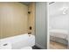 Modern bathroom featuring wood look tile surround and black fixtures at 1366 W Point Dr, Mount Pleasant, SC 29466