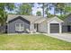 Charming home with a neatly kept lawn and an inviting front patio seating area at 1366 W Point Dr, Mount Pleasant, SC 29466