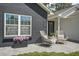 Home exterior featuring a cozy patio with chairs, brickwork, and a decorative wreath at 1366 W Point Dr, Mount Pleasant, SC 29466