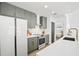 Well-lit kitchen with white countertops, stainless steel oven, and green cabinets at 1366 W Point Dr, Mount Pleasant, SC 29466