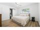 Cozy main bedroom with natural light, barn door and a ceiling fan at 1366 W Point Dr, Mount Pleasant, SC 29466