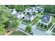 An aerial view of homes in a neighborhood showcases manicured lawns and beautiful landscaping at 1417 Roustabout Way, Charleston, SC 29414