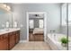 This bathroom features a soaking tub, tile floors, and view to the bedroom at 1417 Roustabout Way, Charleston, SC 29414