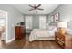This bedroom features a TV, ceiling fan, and stylish bedside table with lamps at 1417 Roustabout Way, Charleston, SC 29414