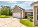 Beautiful home with a two car garage, well-maintained lawn, and manicured landscaping at 1417 Roustabout Way, Charleston, SC 29414