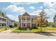 Charming two-story home with a welcoming front porch and a beautifully landscaped yard at 1417 Roustabout Way, Charleston, SC 29414