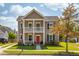 Charming two-story home with a welcoming front porch and well-manicured lawn in a suburban neighborhood at 1417 Roustabout Way, Charleston, SC 29414