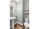 Stylish half bathroom featuring modern fixtures, elegant decor, and a pedestal sink at 1417 Roustabout Way, Charleston, SC 29414