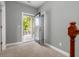 Hallway with an open door to a deck offering scenic views and natural light at 1417 Roustabout Way, Charleston, SC 29414