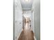 Hallway view showcasing stainless steel fridge and flowing layout to the kitchen and living areas at 1417 Roustabout Way, Charleston, SC 29414