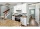 This well-lit kitchen shows granite counters, an gas oven, and a convenient layout for cooking and entertaining at 1417 Roustabout Way, Charleston, SC 29414