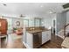 Spacious kitchen area flows to living area, showcasing granite counters and seamless transition to living spaces at 1417 Roustabout Way, Charleston, SC 29414