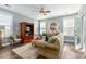 Cozy living room features stylish furniture, a ceiling fan, and plenty of natural light at 1417 Roustabout Way, Charleston, SC 29414