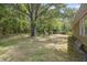 Expansive backyard with large trees, green grass, shed, and play area at 158 Whippoorwill Dr, Summerville, SC 29483