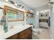 Bathroom with dual sink vanity, a large mirror, and a soaking tub in the background at 158 Whippoorwill Dr, Summerville, SC 29483
